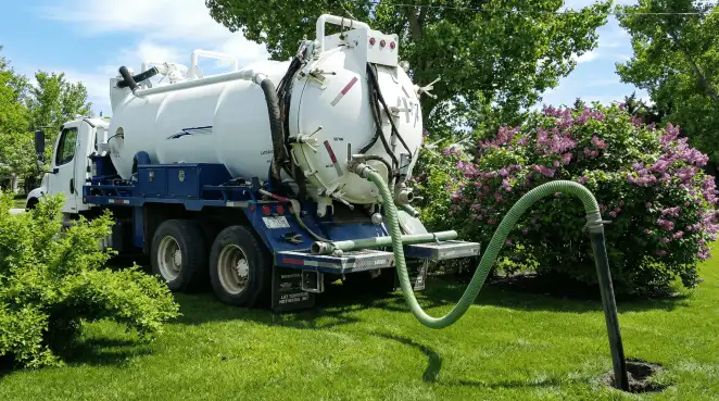 Professional vacuum truck performing residential drainage and septic maintenance in Naperville, IL