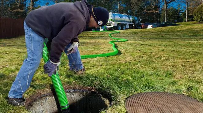 Service technician performing residential septic pumping and drainage maintenance in Naperville, IL